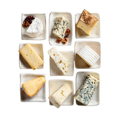 A selection of nine different cheeses arranged in a grid on small ceramic dishes, top-down view.

