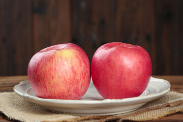 Fresh Red Fuji Apples from Shaanxi Luochuan China on Rustic Wooden Table