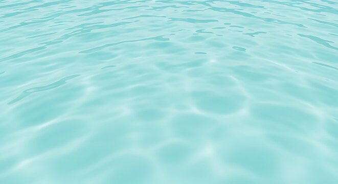 Peaceful and serene background of clear light blue swimming pool water with sun glare and caustic reflections