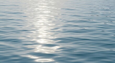 Gentle Water Surface with Sunlight Reflections A Tranquil, Rippling Landscape