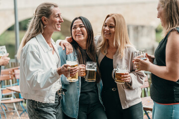 Cheerful friends enjoy beer toasts together in a Bavarian beer garden on a warm summer day celebrating tradition culture joy and leisure