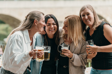 Friends gather in a Bavarian beer garden to celebrate summer with beer glasses raised enjoying laughter joy culture and festive tradition