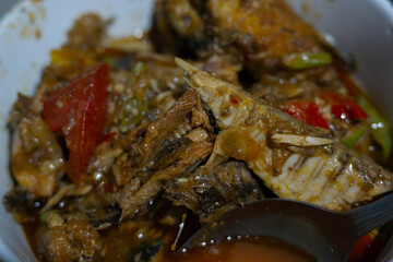 Homemade Indonesian Spicy Sardine Fish with Tomato and Chili in a White Bowl
