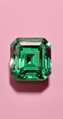 A vibrant emerald gemstone cut in an emerald shape displayed on a soft pink background.