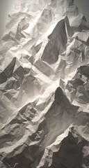 Textured abstract mountain range formed from crumpled paper material.