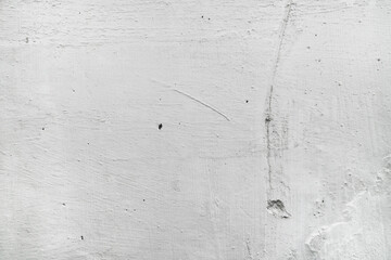 Closeup of a textured white or light gray wall, suitable for background images, interior design concepts, and architectural presentations.
