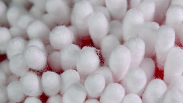 Cotton swabs rotating, cotton buds macro shot. Personal hygiene and cosmetic items. Ear cleaning q-tips