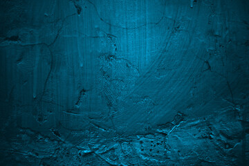 Textured blue wall ideal for backgrounds, textures, urban designs, and grunge concepts with cracks and imperfections for creative projects.