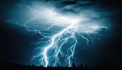 Powerful lightning strikes against a dark sky