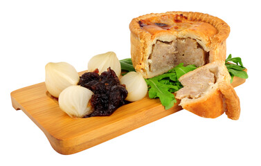 Classic British crusty pork pie with red onion chutney isolated on a chutney background