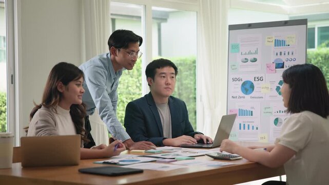 Future Growth Net zero waste ESG office SDGs happy work project social risk plan idea. Diverse Group asia people go green stock market data class advice talking report asian startup workshop training.