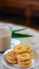 Breakfast and snack menu. Butter biscuits with pineapple jam and a glass of chocolate milk. Close-up of butter cookies and a glass of chocolate, sweet cakes. Perfect for recipes, articles, catalogs.