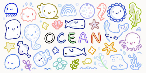 Cute hand drawn ocean creatures and elements with the word ocean in colorful letters