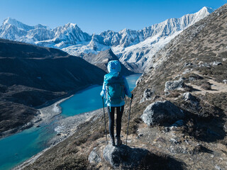 Successful woman hiker on high altitude mountain top