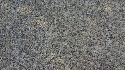 Close-up of Textured Concrete Surface with Pebbles