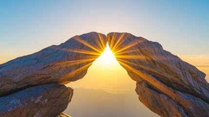 Natural Rock Arch with Sun Rays at Sunrise against Clear Blue Sky Landscape