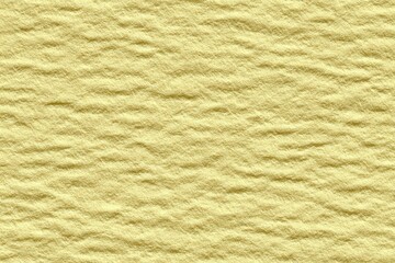 Light yellow textured surface with subtle ripples