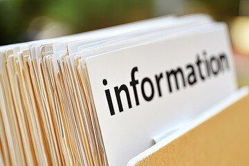 A close-up of a file labeled "information," displaying neatly organized documents ready for easy access.
