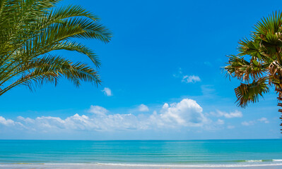 Nature of the ocean and blue sky Summer with sunshine, sandy beaches, clear blue waters sparkling against the blue sky. on an island with good ecology and environment Background for summer vacation