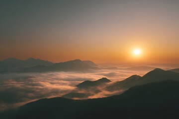 Fototapeta premium View of a mountain range with a sun setting