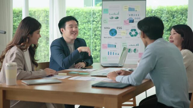 Happy workplace diverse team group young adult gen Z asia people man woman candid work at office class enjoy talk laugh relax idea advice in go green eco friendly future growth worker mental health.