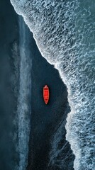 Solitary red boat on dark beach, aerial view