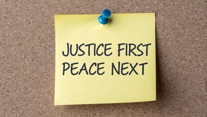 Motivational Sticky Note Displaying Justice First and Peace Next on Corkboard Background for Inspirational Concepts