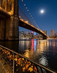 Fototapeta premium New York City Skyline at Night from Brooklyn Bridge