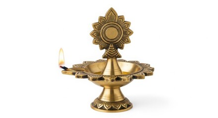 Fototapeta premium A traditional indian brass oil lamp with a lit wick, isolated on a white background