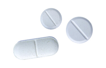 group of white pills isolated on white background