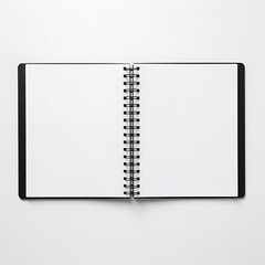 Open blank spiral bound notebook isolated on white background