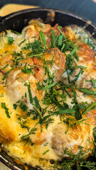 Cooked potato with cheese closeup. Restaurant food background.