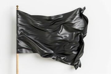 A wrinkled black flag displayed on a pole against a white background.