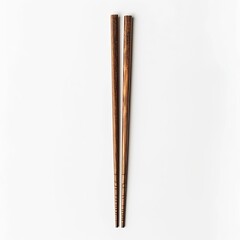 A pair of wooden chopsticks placed parallel on a white background.