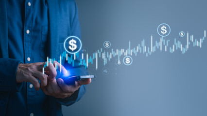Businessman using smartphone with digital dollar icons and financial stock chart, symbolizing mobile banking, online investment, fintech trading, cryptocurrency, digital wallet and financial growth.