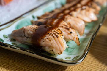 roasted salmon nigiri with sauce