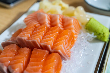 salmon sashimi with rakyo and pickled ginger