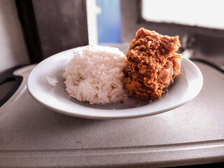Fried Crispy Chicken with Steamed White Rice on Plate