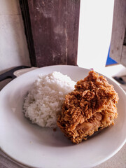 Fried Crispy Chicken with Steamed White Rice on Plate