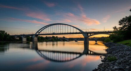 Fototapeta premium Bridge over river sunset reflection