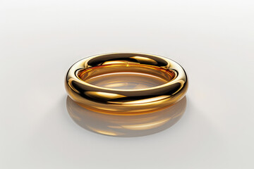 A shiny golden ring with a smooth design, reflecting light on a minimalistic surface.