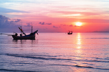 Sea sunset landscape, beautiful ocean sunrise, tropical island beach, fisherman boat, ship silhouette, blue waves, colorful pink red orange sky, water sun reflection, summer holidays, vacation, travel