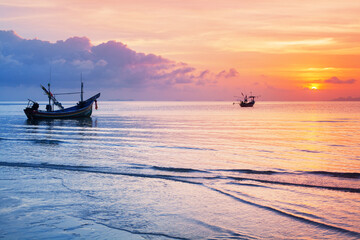 Sea sunset landscape, beautiful ocean sunrise, tropical island beach, fisherman boat, ship silhouette, blue waves, colorful pink red orange sky, water sun reflection, summer holidays, vacation, travel