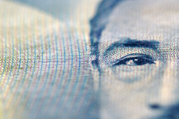 Close-Up View of Eye on Currency Note with Fine Printing Details