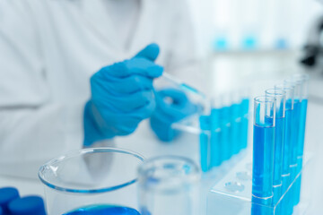 Fototapeta premium Scientist analyze biochemical samples in advanced scientific laboratory. Medical professional use dropper mix microbiological developmental of viral. Biotechnology research in science lab. cosmetic