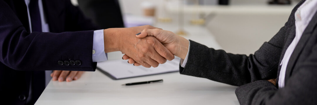 Business partnership agreement handshake legal professionals office meeting corporate trust collaboration deal