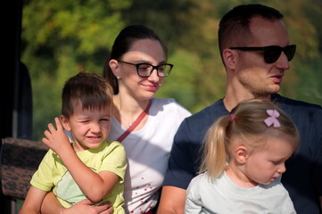 Fototapeta premium Family with two children riding in cable car