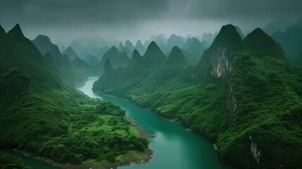 Majestic Mountains Looming Over Serene River in Mystical Green Landscape
