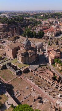 Stunning aerial footage of ancient Roman ruins, highlighting architectural marvels against a picturesque landscape that embodies the essence of history. Rome, Italy