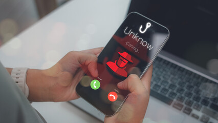 Phone screen showing a phishing scam call from an unknown number. Concept of digital fraud, cybercrime, identity theft, mobile security alert, and online privacy protection.